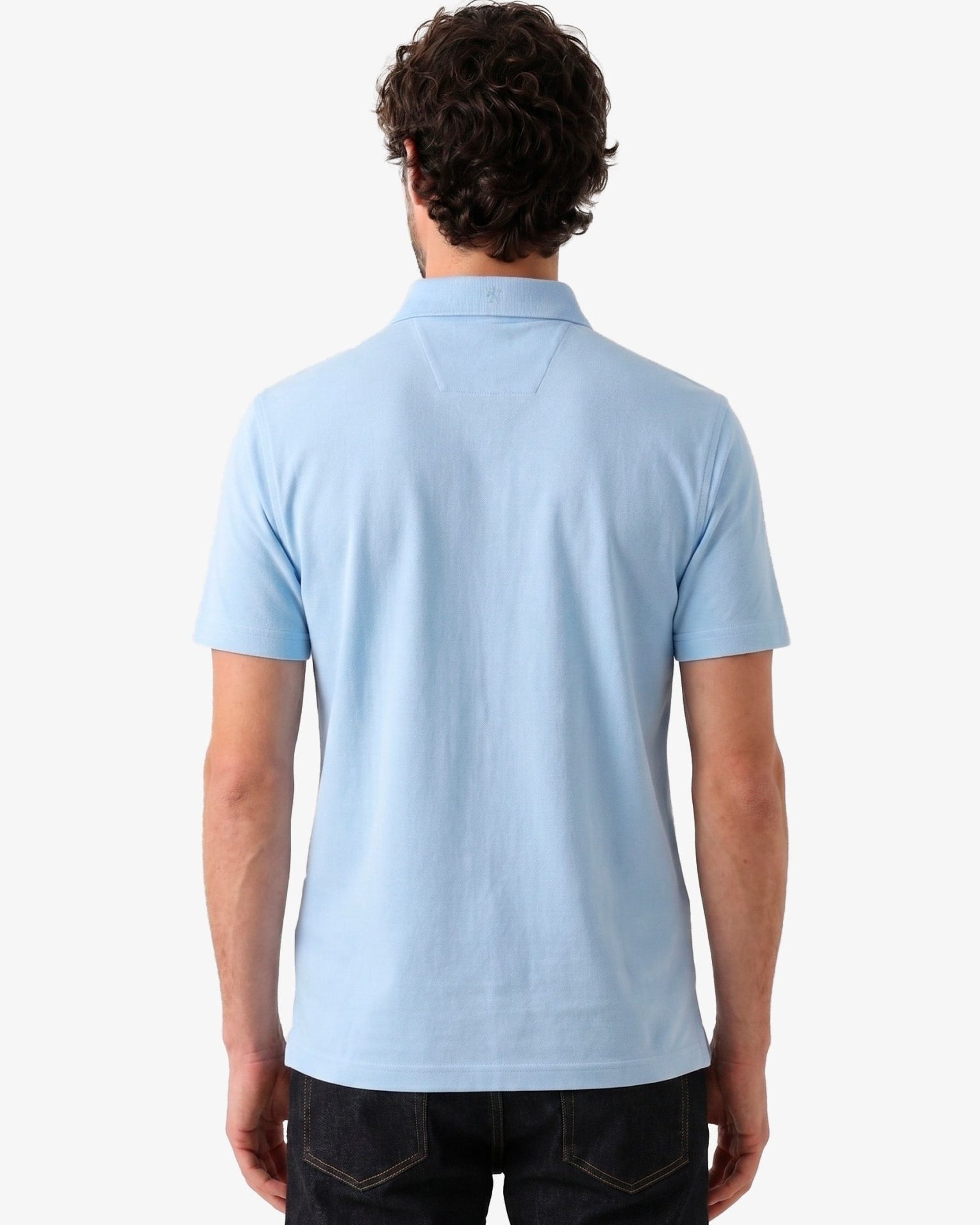 Manchester Performance Playera Polo Slim Fit color cielo para hombre