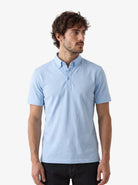Manchester Performance Playera Polo Slim Fit color cielo para hombre