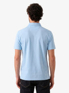 Manchester Performance Playera Polo Slim Fit color cielo para hombre