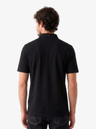 Manchester Performance Playera Polo Slim Fit color negro para hombre