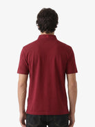 Manchester Performance Playera Polo color guindo para hombre