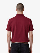 Manchester Performance Playera Polo Slim Fit color guindo para hombre